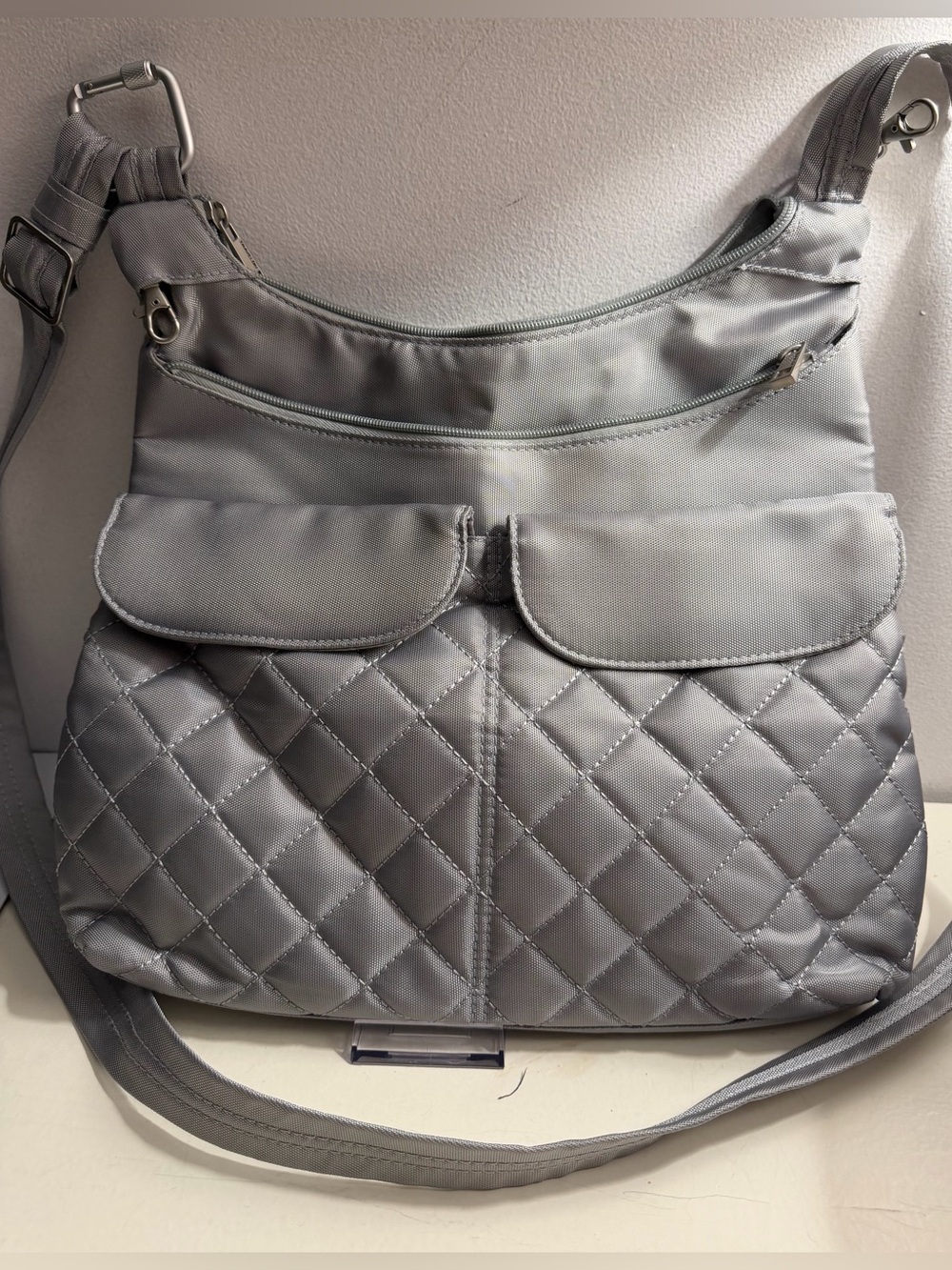 Travelon silver nylon messenger crossbody bag.